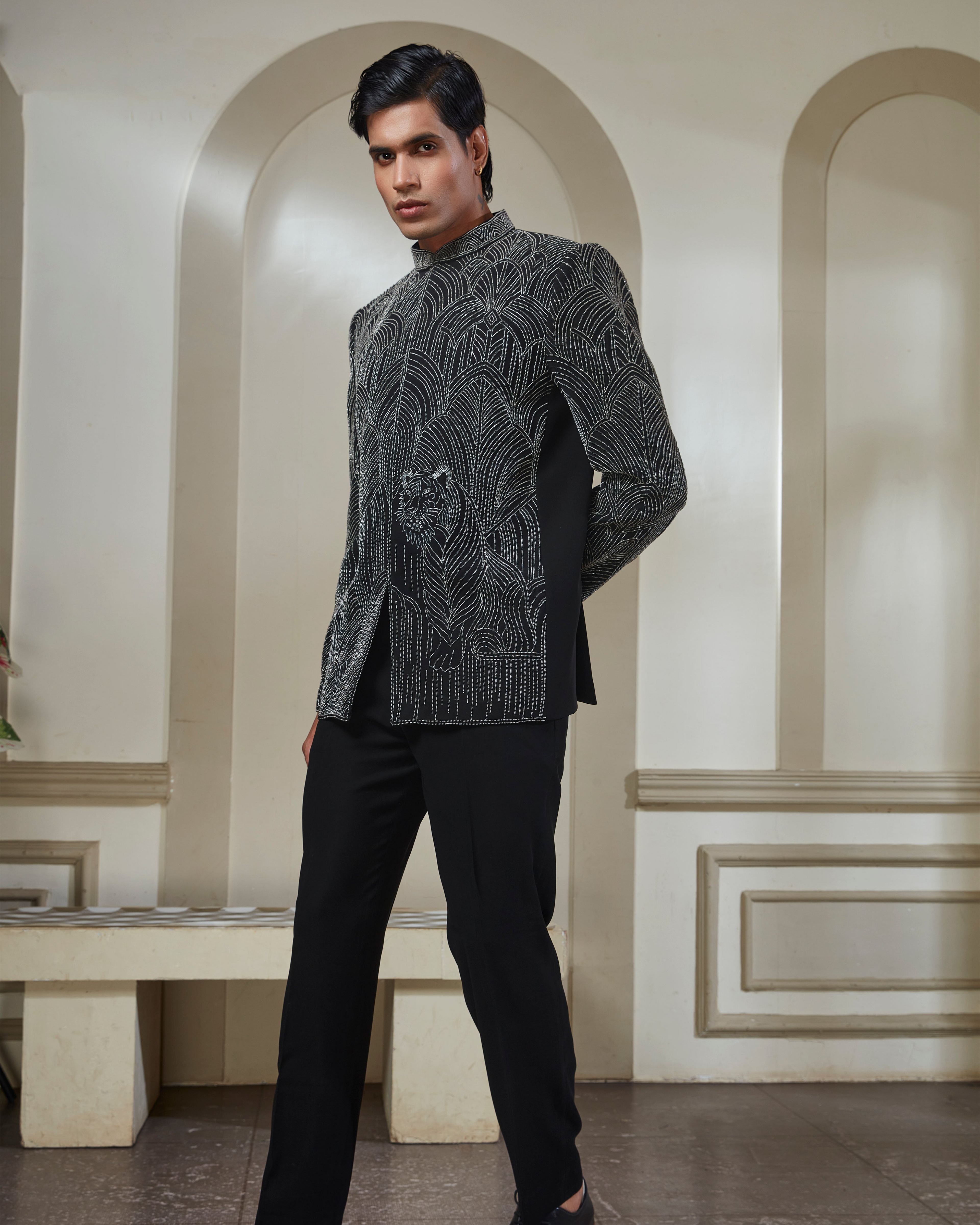 A man wearing a light blue traditional Indian suit with a mandarin collar jacket and matching trousers | Aditya Bhardwaj