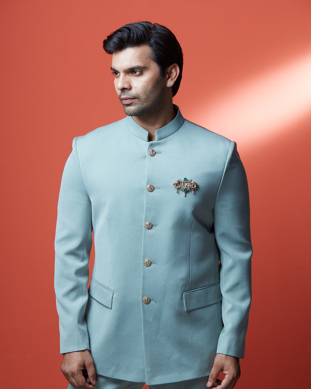 A man wearing a light blue traditional Indian suit with a mandarin collar jacket and matching trousers | Aditya Bhardwaj