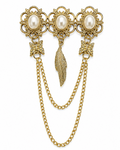 A vintage-style gold-tone brooch featuring three ornate floral clusters with white faux pearls, a central textured feather pendant, star-shaped links, and two draped chain drops on a white background.